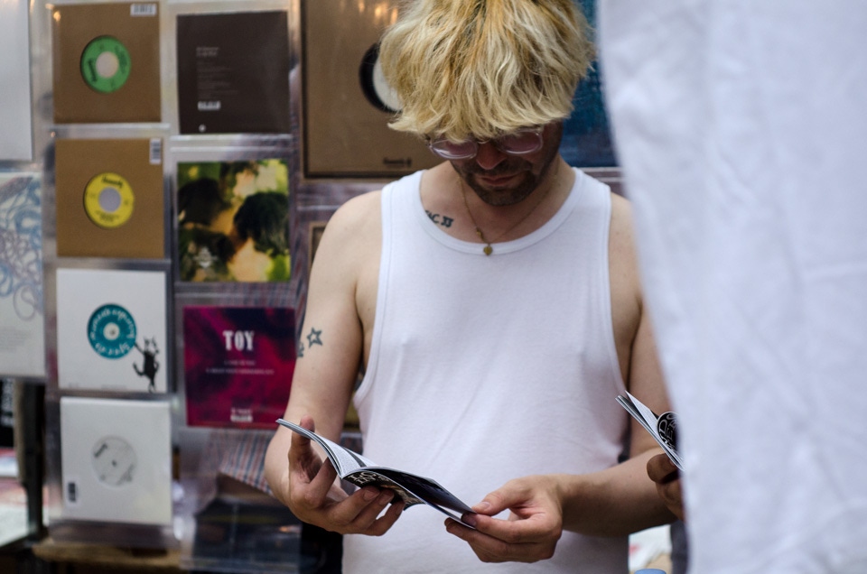 Tim Burgess takes a moment to leaf through some zines