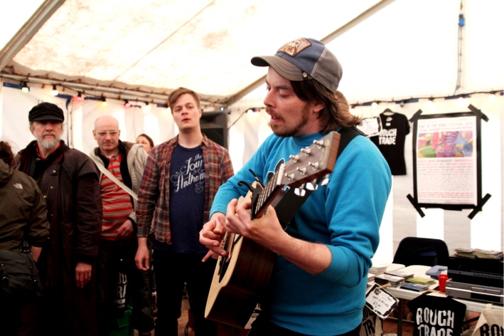 Dad Rocks playing at the Rough Trade stall.